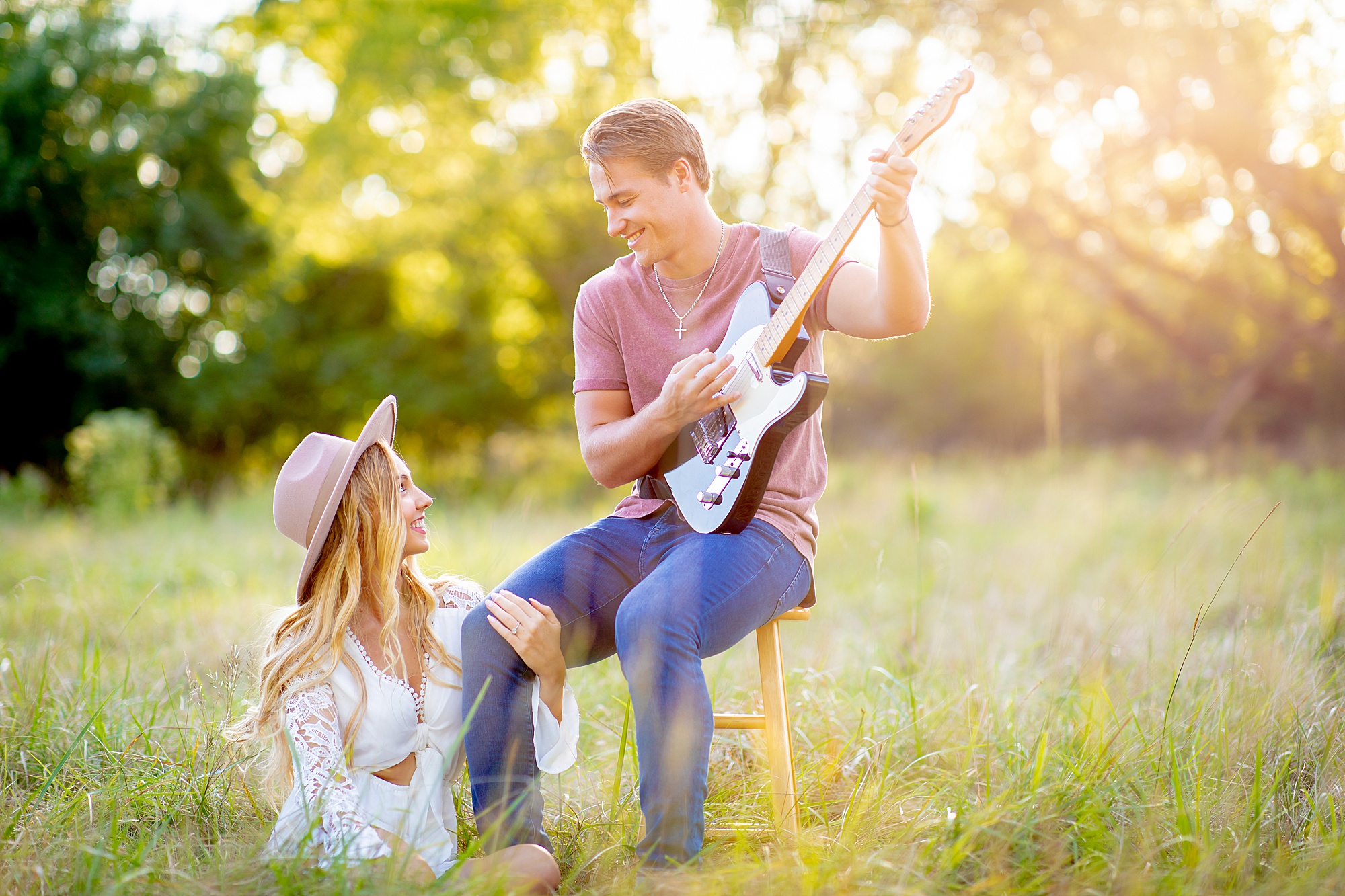 beautiful photo of man playing guitar to his wife