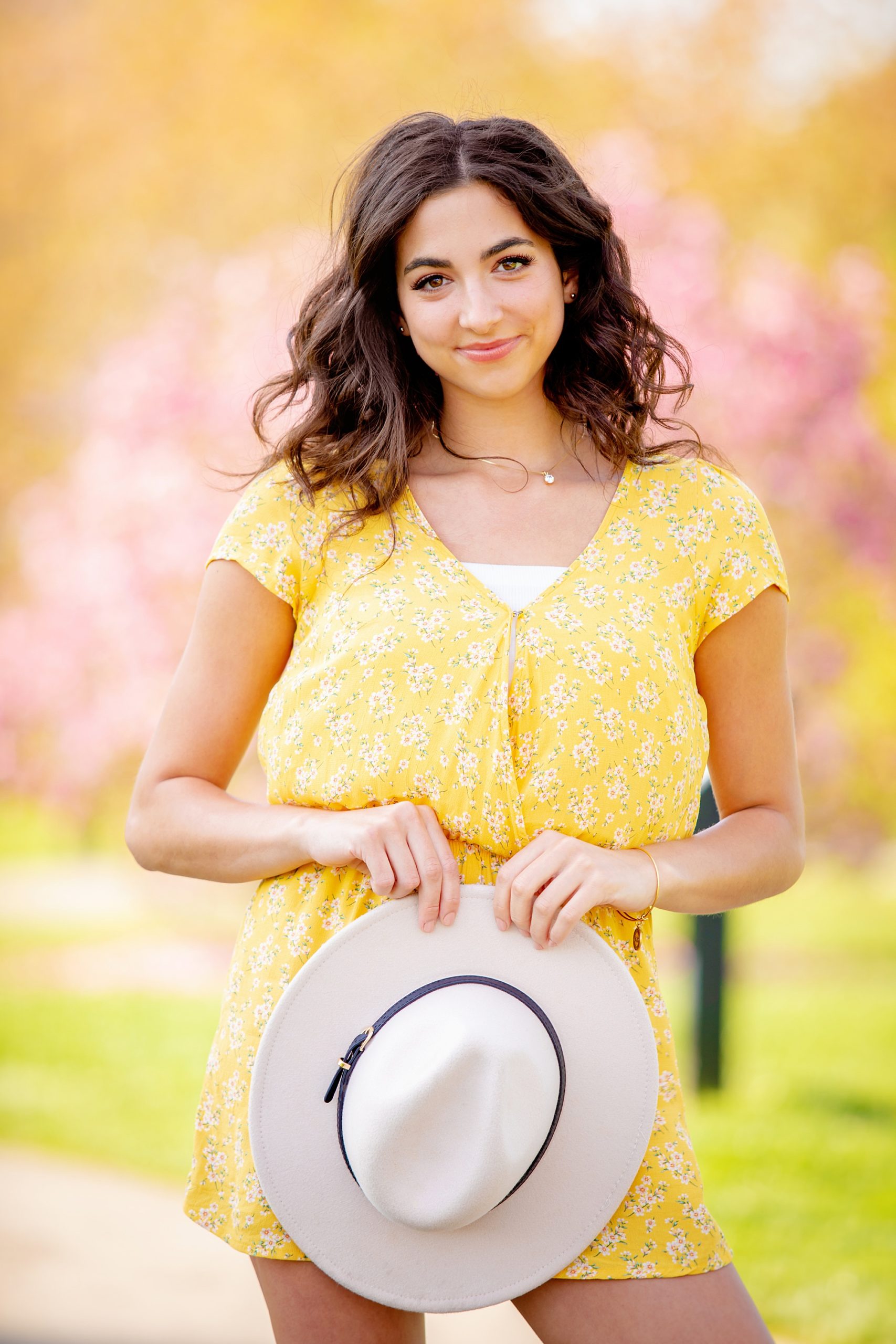 woman in yellow during light and airy portrait session 