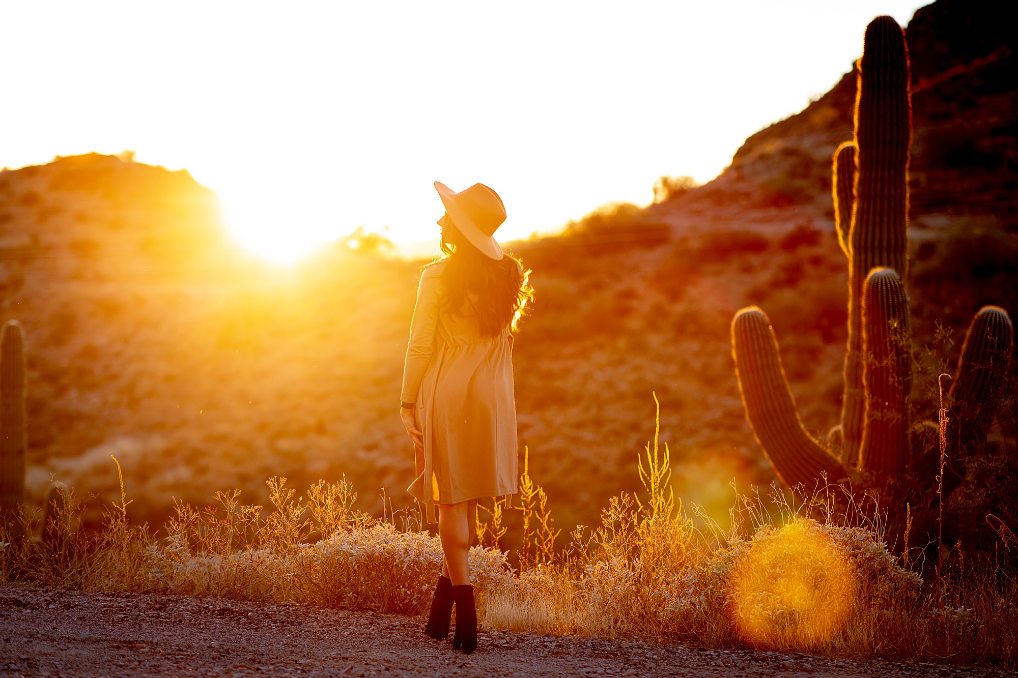 woman walks in AZ desert captured by traveling portrait photographer Emily Finger
